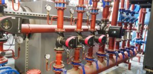 Air Plants Heating & Cooling (image of red pipes)